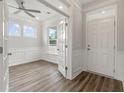 Home office with hardwood floors, white wainscoting, and French doors at 115 Ashley Cove Way, Summerville, SC 29483