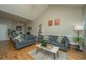 Bright living room with hardwood floors, comfy couches, and a high ceiling at 1984 Folly Rd # B304, Charleston, SC 29412