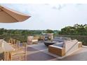 Relaxing rooftop deck with outdoor furniture and scenic views at 618 Waterman St # 618, Charleston, SC 29492