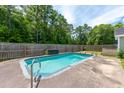 Inviting in-ground pool with concrete decking, perfect for relaxation at 166 Blackstone Dr, Moncks Corner, SC 29461