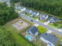 Aerial view of neighborhood with homes, playground, and pool at 166 Blackstone Dr, Moncks Corner, SC 29461