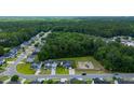 Aerial view of suburban neighborhood with tree-lined streets at 166 Blackstone Dr, Moncks Corner, SC 29461