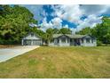 Ranch style home with attached garage and spacious lawn at 3820 Gardenhill Rd, Mount Pleasant, SC 29429