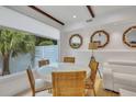 Bright dining area with round table and chairs near living room at 40 Morris St, Charleston, SC 29403
