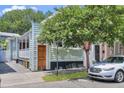 Quaint light green house with white trim and porch at 40 Morris St, Charleston, SC 29403