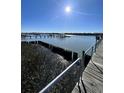 Serene view of wooden docks extending over the water at 3001 Buccaneer Rd, Isle of Palms, SC 29451