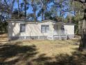 Mobile home exterior features a light beige exterior, white trim, and a covered porch at 224 Ruth Anne Dr, Summerville, SC 29483
