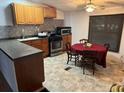 Bright kitchen with wood cabinets, tile backsplash, and a dining area at 224 Ruth Anne Dr, Summerville, SC 29483