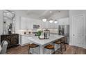 Modern kitchen featuring white cabinets, stainless steel appliances, and a large island at 66 Cooper St, Charleston, SC 29403