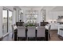 Bright dining room with hardwood floors and seating for eight at 66 Cooper St, Charleston, SC 29403