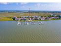 Aerial view of waterfront property with numerous boat slips at 2 Mcdonough Rd # F-2, Folly Beach, SC 29439