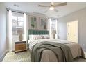 Light and airy bedroom with a green upholstered bed at 139 Dantzler Rd, Harleyville, SC 29448