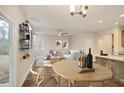 Bright dining area with wood table and access to backyard at 139 Dantzler Rd, Harleyville, SC 29448