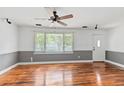 Bright living room with hardwood floors and large window at 3308 Londonderry Rd, North Charleston, SC 29420