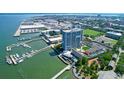 Aerial view of waterfront property with a high-rise building and marina at 330 Concord St # 5 A, Charleston, SC 29401
