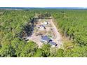 Aerial view of a new home community with several houses under construction at 517 Rendezvous Way, Huger, SC 29450