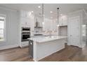 Spacious kitchen featuring white shaker cabinets, stainless steel appliances, and a large island at 1411 Dahlia Rd, Mount Pleasant, SC 29464