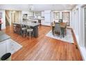 Spacious kitchen with hardwood floors, granite island, and breakfast area at 3610 Legareville Rd, Johns Island, SC 29455