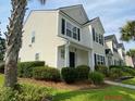 Two story tan house with black shutters and walkway at 9019 Maple Grove Dr, Summerville, SC 29485