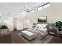 Main bedroom with high ceilings, wood floors, and ensuite bathroom at 2317 Tall Sail Dr # 1007 G, Charleston, SC 29414