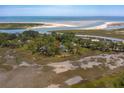 Private island home nestled amongst lush greenery with water views at 3064 Marshgate Dr, Seabrook Island, SC 29455