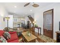 Open living area with hardwood floors, red couch, and kitchen view at 291 Coming St, Charleston, SC 29403