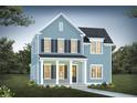 Two-story light blue house with dark shutters, a front porch and walkway at 400 Swaying Pine Ln, Summerville, SC 29486