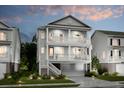 Two-story home with gray siding, balconies, and a detached garage at 1635 Siloh Dr # 483, Mount Pleasant, SC 29466