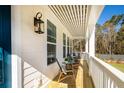 Relaxing front porch with rocking chairs and a view of the backyard at 1635 Siloh Dr # 483, Mount Pleasant, SC 29466