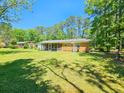 Home with a large backyard and screened porch at 209 Fenwick Rd, Walterboro, SC 29488