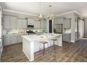 Modern kitchen with island, stainless steel appliances, and hardwood floors at 1089 Keeper Ln, Summerville, SC 29485