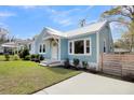 Side view of charming light blue cottage at 4961 Baylor Ave, North Charleston, SC 29405