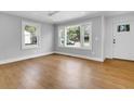 Bright living room with hardwood floors and large windows at 4961 Baylor Ave, North Charleston, SC 29405