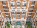 Indigo building exterior showcasing multiple balconies and courtyard at 609 King St # 603, Charleston, SC 29403
