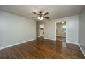 Open living room with hardwood floors, offering views into the kitchen area at 4418 Cindy Ln, North Charleston, SC 29418