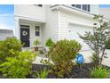 Front door entrance with landscaping and ADT security sign at 315 Black Birch Dr, Summerville, SC 29486