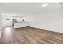 Open living area with hardwood floors and kitchen at 2312 Meridian Rd, North Charleston, SC 29405