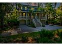 Two story home with a landscaped lawn and driveway at 3350 Seabrook Island Rd, Seabrook Island, SC 29455