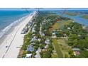 Property location shown with beach and Folly Downtown in the background at 1302 E Ashley Ave, Folly Beach, SC 29439