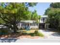 Two-story home with a spacious yard and attached garage at 1302 E Ashley Ave, Folly Beach, SC 29439