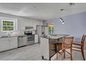 Modern kitchen with white cabinets and granite counters at 8300 Berringer Bluff Dr, Charleston, SC 29418