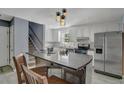 Modern kitchen with white cabinets and granite counters at 8300 Berringer Bluff Dr, Charleston, SC 29418