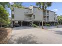 Building exterior showcasing parking and elevated design at 1647 Live Oak Park, Seabrook Island, SC 29455