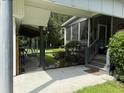 Home exterior showcasing a screened porch and fenced yard at 86 Watershed Ct, Walterboro, SC 29488