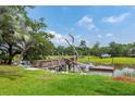 Private wooden dock with steps leading to the water at 687 Oak Marsh Dr, Mount Pleasant, SC 29464