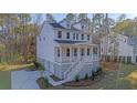 Two story house with front porch and attached garage at 509 Twin Lakes Dr, Summerville, SC 29483