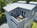 Private rooftop deck with seating and city views at 315 Ashley Ave # C, Charleston, SC 29403
