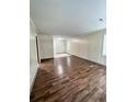 Living room with wood-look floors and wood paneled walls at 313 Pine Needle Rd, Walterboro, SC 29488