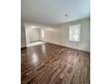Spacious living room with wood-look floors and wood paneling at 313 Pine Needle Rd, Walterboro, SC 29488