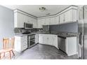 Kitchen with white cabinets, granite countertops, and stainless steel appliances at 215 Cantilever Ct, Summerville, SC 29486